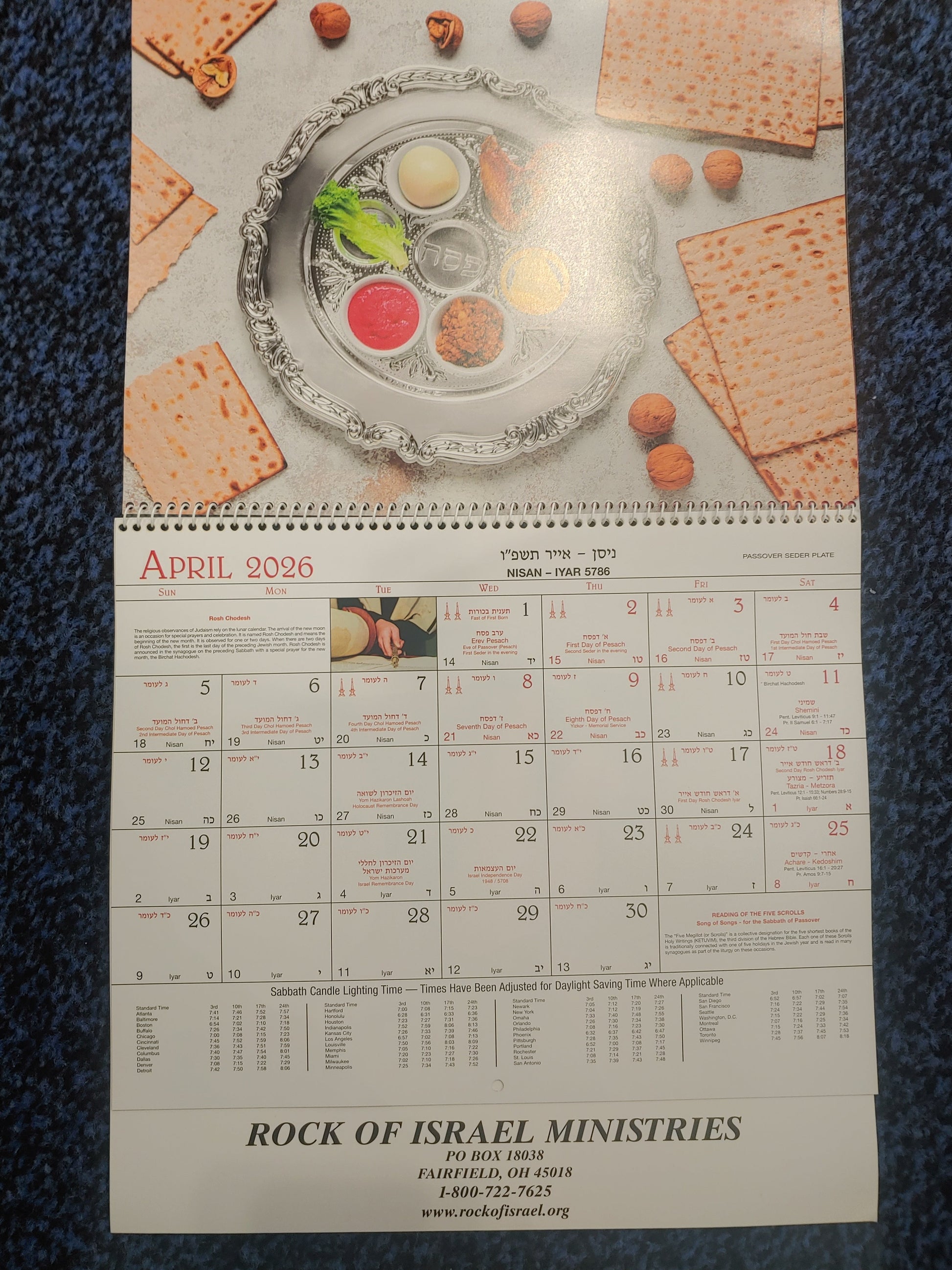Calendar with Passover Seder plate and matzah on a textured surface